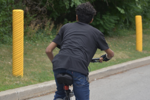 Photo of a kid biking. 